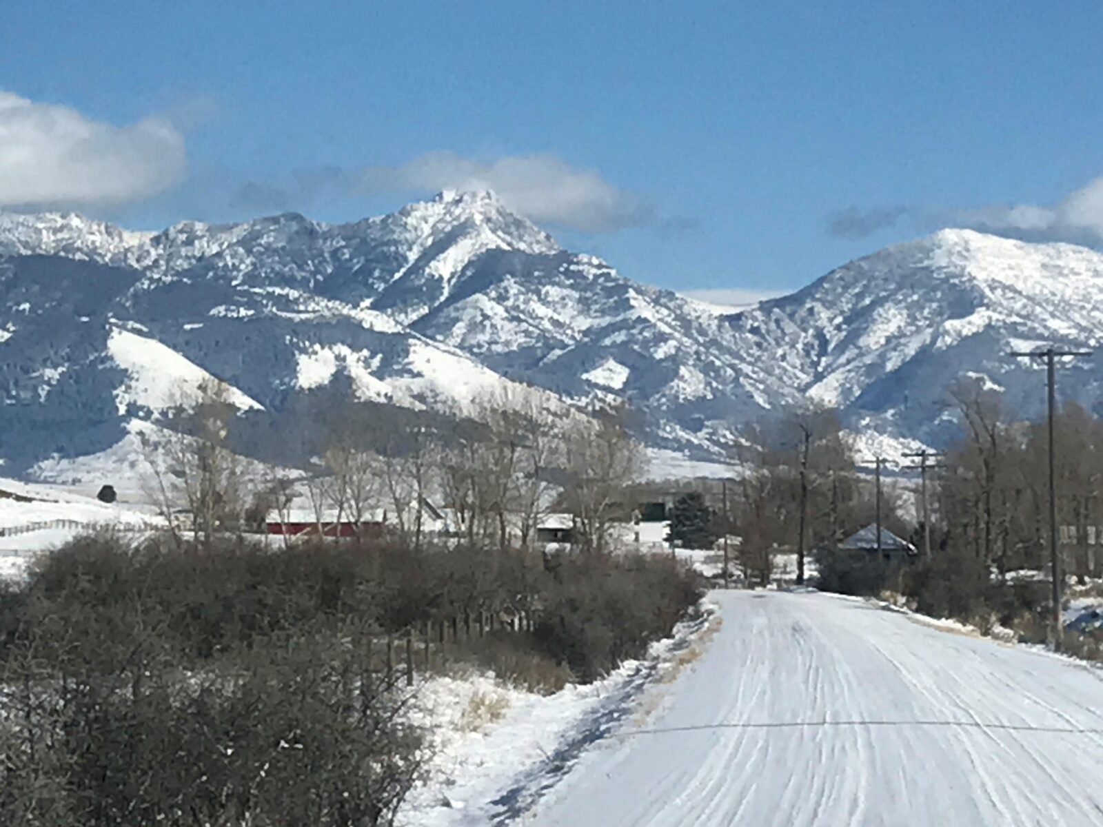 Snowy mountain view with a winter road