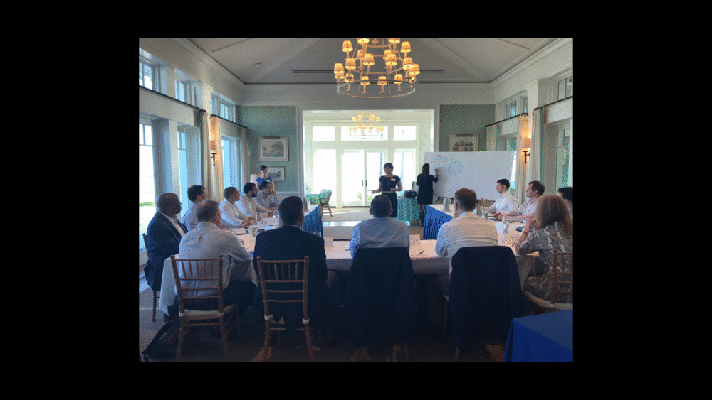 Business meeting with a presentation in a well-lit conference room.