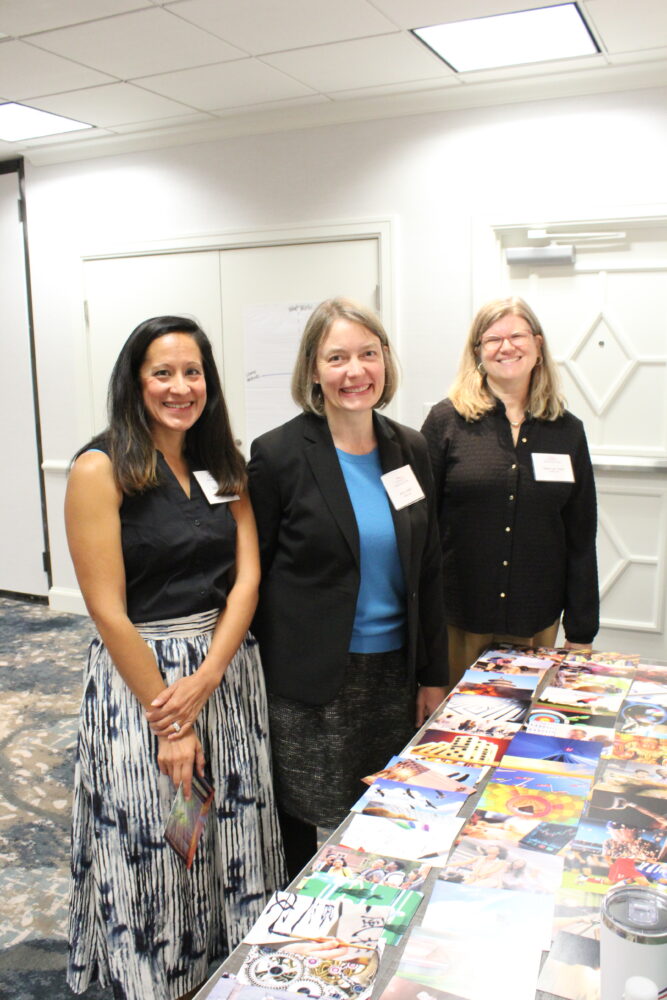 Three-women-at-information-table